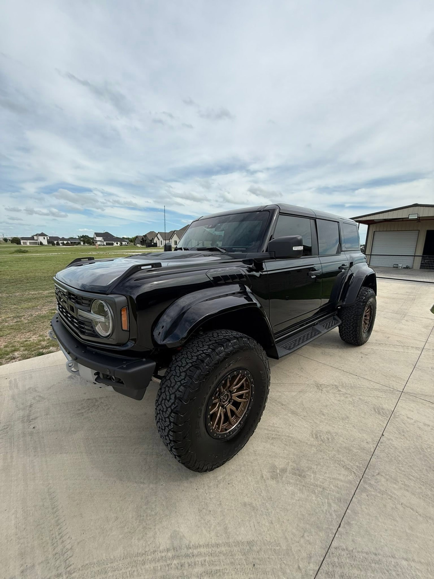 Black Ford Bronco Raptor detailed and gleaming on the driveway
